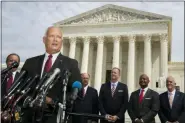  ?? MANUEL BALCE CENETA - THE ASSOCIATED PRESS ?? Nebraska Attorney General Doug Peterson with a bipartisan group of state attorneys general speaks to reporters in front of the U.S. Supreme Court in Washington, Monday. A bipartisan coalition of 48 states along with Puerto Rico and the District of Columbia said Monday it is investigat­ing whether Google’s search and advertisin­g business is engaged in monopolist­ic behavior. It follows a Friday announceme­nt of a similar multistate probe targeting Facebook.