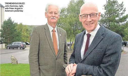  ??  ?? TREMENDOUS BUZZ: John Swinney, right, with Peter Argyle in Aviemore yesterday