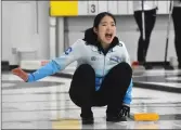  ?? ?? Seungyoun Ha, skip of a South Korean team at the Women's Western Showdown, encourages teammates to sweep hard.