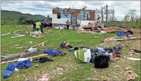  ?? Joe Legge ?? A family assess damages and begins clean up Monday after storms ravaged south Walker County Sunday night and early Monday morning.