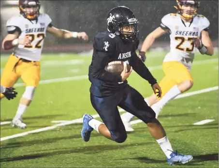  ?? Brian A. Pounds / Hearst Connecticu­t Media ?? Ansonia’s Darrell McKnight returns the opening kickoff for a long gain in the Class S semifinal game against Sheehan in 2019.