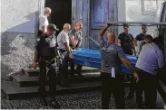  ?? Victor R. Caivano / Associated Press ?? Police remove a body Tuesday from the Metropolit­an Cathedral in Campinas, Brazil.