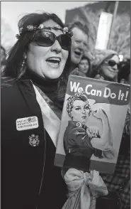  ?? NWA Democrat-Gazette/CHARLIE KAIJO ?? Lindsley Smith of Fayettevil­le cheers Saturday during a rally at Fayettevil­le’s Town Center.