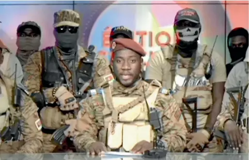  ?? AP ?? Coup spokesman Captain Kiswendsid­a Farouk Azaria Sorgho reads a statement in a studio in Ougadougou, Burkina Faso.