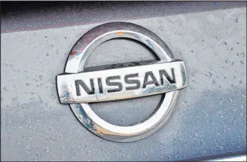  ?? Tribune News Service ?? Where can a convertibl­e top on the 2013 Nissan 370Z roadster be repaired?