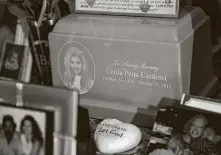  ??  ?? Cardona’s remains rest in a pink box on a table decorated with memories her mother keeps inside her home.