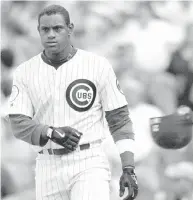  ?? DANIEL LIPPITT/AFP/GETTY IMAGES/FILES ?? Sammy Sosa is one of the steroid-tainted sluggers whose stats would merit induction into the Hall of Fame.