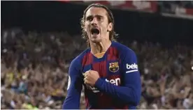  ?? JOSEP LAGO/AFP ?? Antoine Griezmann celebra uno de sus dos goles con el FC Barcelona ante el Betis de Sevilla.