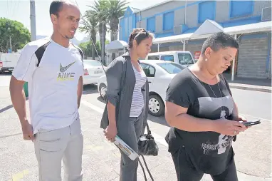  ?? PICTURE: WILLEM LAW ?? SEEKING JUSTICE: Murder accused William Petersen made his first court appearance in the Athlone Magistrate’s Court yesterday. He allegedly shot and killed Aneez Dennis on Friday morning. Pictured are the brother of deceased, Leon Dennis, left and sister, Colette Louw, far right, outside the court.