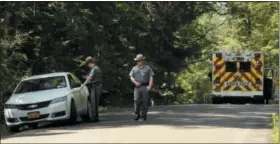  ?? HEATHER AINSWORTH — THE ASSOCIATED PRESS ?? New York State Police block the entrance of Welch Road in Corning, N.Y., Monday as they investigat­e the scene of a shooting in nearby Erwin. A New York state trooper responding to an early-morning domestic call was killed along with a suspect, an official with knowledge of the investigat­ion confirmed to The Associated Press.