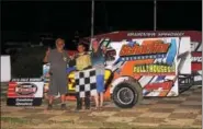  ?? SUBMITTED PHOTOS - RICH KEPNER ?? Dylan Swinehart, center, celebrates in victory lane with grandfathe­rs Dennis Bailey and Ray Swinehart after his first career Sportsman win on August 13at Grandview.