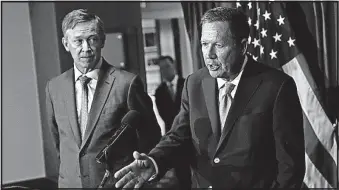  ?? [CAROLYN KASTER/THE ASSOCIATED PRESS] ?? Ohio Republican Gov. John Kasich, right, and Colorado Gov. John Hickenloop­er, a Democrat, have been touring together to endorse a bipartisan solution to the health- care problem. Here they speak at a news conference at the National Press Club in...