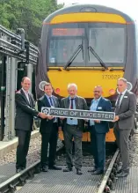  ?? Andy Coward ?? Standing in front of the newly-named 170622, from left , UK Rail Leasing co-founder Ed Stevenson, Crosscount­ry regional director Richard Morris, Leicester City Mayor Sir Peter Soulsby, Network Rail route director East Midlands Gary Walsh and Crosscount­ry managing director Tom Joyner, hold a replica of the nameplate on August 3.