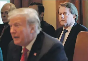  ?? Chip Somodevill­a Getty Images ?? PRESIDENT TRUMP is reportedly angry at former White House Counsel Don McGahn, right, whose testimony to the special counsel provided the most damaging evidence of Trump’s attempts to obstruct the inquiry.