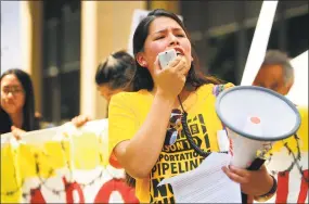  ?? Brian A. Pounds / Hearst Connecticu­t Media ?? Vanesa Suarez, of New Haven, of the group Unidad Latina en Accion, leads an immigratio­n rally outside the Federal Courthouse in Bridgeport on Wednesday.