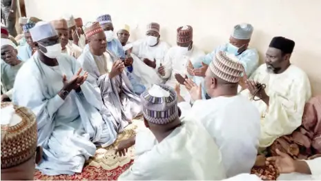  ?? Deputy Gov. Usman Khadafu with relatives of NGO worker in Maiduguri on Thursday ??