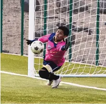  ?? MIKE SANDOVAL/FOR THE JOURNAL ?? Atrisco Heritage goalkeeper Jose Corral can’t quite reach this penalty kick off the foot of Rio Rancho’s Jamal Bynum during Saturday’s game at the APS Complex. But the Jaguars won, 3-2.