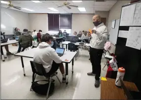  ?? (NWA Democrat-Gazette/J.T. Wampler) ?? J Keith teaches eighth-grade social studies Dec. 17 at Lincoln Middle School. The rural district in Northwest Arkansas has seen online enrollment decline to about 20% of its 1,000 students.