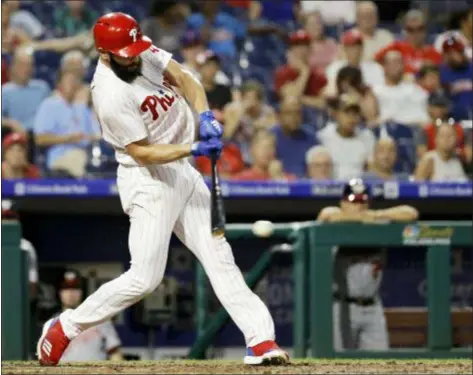  ?? MATT SLOCUM — THE ASSOCIATED PRESS ?? Phillies pitcher Jake Arrieta connects on a two-run single off Nationals starter Gio Gonzalez during the second inning of an 8-6 victory over Washington Wednesday at Citizens Bank Park.