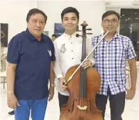  ??  ?? Congressma­n Eric Singson (left) with Candon scholar Christian Geo Molina, who is now a cellist with the Manila Symphony Orchestra and Manila Symphony Junior Orchestra.