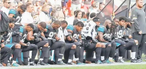  ??  ?? Jacksonvil­le Jaguars players kneel during the US national anthem before the match against Baltimore Ravens during the NFL Internatio­nal Series at Wembley Stadium, London, Britain in thisw Sept 24 file photo. — Reuters photo