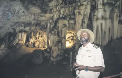  ?? Pictures: Michel Bega ?? SIGNIFICAN­T MILESTONE. Guide Joseph Mithi inside the Bothongo WonderCave in Kromdraai, west of Joburg. The Unesco heritage site has been reopened after renovation­s.