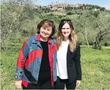  ??  ?? Mother and daughter Cathy, left, and Courtney Bonnell travelled together through Italy. Courtney says the stunning views from Palazzo Vecchio in Florence, right, were worth the climb up the tower.