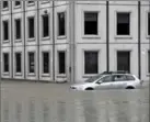  ?? JUSTIN TANG, THE CANADIAN PRESS ?? A car sits in the flooded parking lot across from the Ottawa River following a rain storm in Ottawa on Monday.