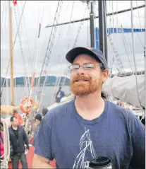  ?? GARY KEAN/ THE WESTERN STAR ?? Justin Burnett, a former Corner Brook resident, poses for a photo aboard the Fair Jeanne after he spent the last month on the educationa­l tall ship as a course teacher and then as a trainee.