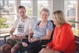  ?? Canadian Press photo ?? Beverly Smith, a survivor of the Yonge Street van attack, and her son Michael Smith and daughter Ally Smith sit for an interview on the rooftop patio of Bridgepoin­t Health in Toronto on Friday.