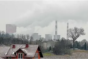  ?? AP ?? Smoke billows from chimney stacks of the heating and power plant in Bedzin, near Katowice, southern Poland. Katowice, in the southern coal mining region, will host global climate summit this week.