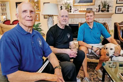  ??  ?? ABOVE: Vietnam veterans, from left, Mike Burton, Tom Baird and Bob Allen, pose for a photo after talking about their service together in the 173rd Airborne Brigade. [PHOTO BY CHRIS LANDSBERGE­R, THE OKLAHOMAN] BELOW: Bob Allen, left, takes a break...