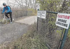  ?? CLIFFORD SKARSTEDT EXAMINER ?? The bridge east of Ackison Rd. along the Jackson Creek Trail, seen Tuesday, is being replaced this fall due to failing condition.