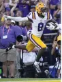  ?? (AP/Gerald Herbert) ?? LSU wide receiver Malik Nabers (8) leaps for the end zone for a 29-yard touchdown Saturday in Baton Rouge. Nabers made six catches for 89 yards a the touchdown, the first score of a 48-18 LSU victory.