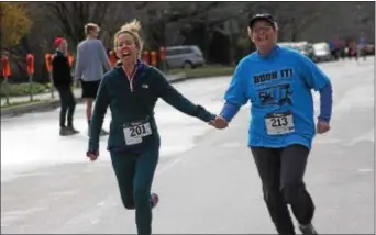  ??  ?? Runners navigate the course from the Helen Kate Furness Library to Swarthmore Public Library in the inaugural Book It! 5k in 2017.