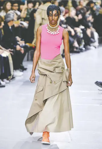  ?? PHOTOS: JONAS GUSTAVSSON/MCV PHOTO/FOR THE WASHINGTON POST ?? Using a trench coat as a skirt, Junya Watanabe’s spring 2020 collection found ways to rework the closet staple into new pieces of interestin­g fashion.