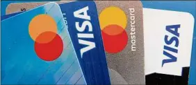  ?? John Raoux / Associated Press ?? Credit card interest is variable so if you have credit card debt, don’t be any more worried than usual about the Fed raising interest rates.