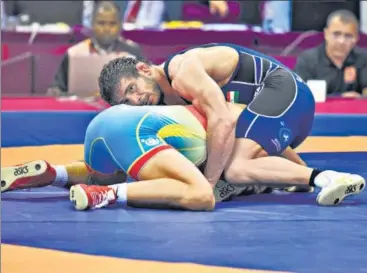  ?? BURHAAN KINU/HT ?? Indian wrestler Jitender Kumar (right) lost to Kazakhstan’s Daniyar Kaisanov in the Senior Asian Wrestling Championsh­ip final.