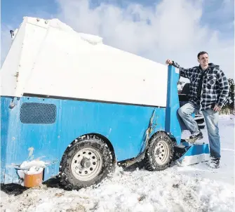  ??  ?? Marko Kardum leans on the Zamboni he and a friend tried out as a snowplow Monday night on a steep cul-de-sac on Tanner Ridge Place in Central Saanich.