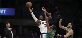  ?? MARCIO JOSE SANCHEZ - THE ASSOCIATED PRESS ?? Los Angeles Lakers’ LeBron James (23) is defended by Boston Celtics’ Marcus Smart (36) and Jayson Tatum during the first half of a game Sunday, Feb. 23, 2020, in Los Angeles.