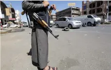  ?? EPA ?? A Houthi fighter mans a checkpoint in Sanaa