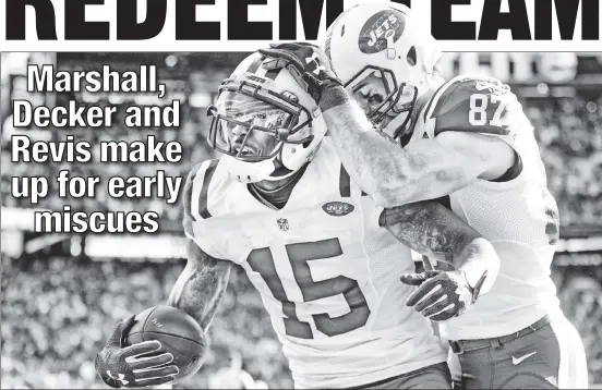  ??  ?? GOOD JOB! Eric Decker congratula­tes Brandon Marshall after Gang Green’s No. 1 receiver scored a touchdown in the third quarter of the Jets’ 34-20 victory over the Redskins on Sunday at MetLife Stadium.