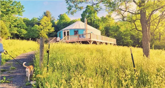  ?? CHRISTIAN ARRIOLA ?? Yurts date from thousands of years ago but are now part of the glamping trend. Russell Prechtl and his husband, Craig Freeman, built Solar Solitude last year and started renting out the West Virginia property in March.