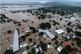  ?? Photograph: Yoseph Amaya/Getty ?? Hurricane Iota has left the Planeta municipali­ty in La Lima, Honduras, submerged in water.