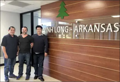  ?? Arkansas Democrat-Gazette/EMMA N. HURT ?? Dung Tran (left) Danial Evans and Le Thai Tinh are three of the 11 employees of Vinh Long, a Vietnamese manufactur­ing company that will open in Morrilton.