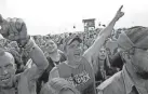  ?? WORLD FILE JOHN CLANTON, TULSA ?? Bryan Watkins of Cushing reacts to a performanc­e by Seether during Rocklahoma in 2014.