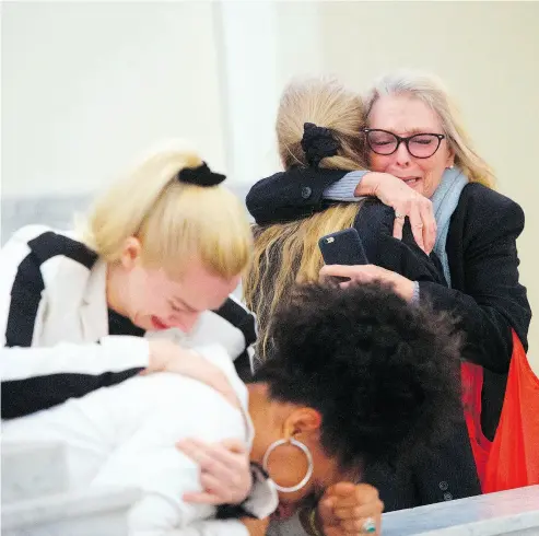  ?? MARK MAKELA / POOL PHOTO VIA THE ASSOCIATED PRESS ?? Accuser Lili Bernard, foreground, is consoled by grief counsellor Caroline Heldman, left, as accuser Victoria Valentino, right, is comforted outside the courtroom after Bill Cosby was found guilty in his sexual assault retrial.