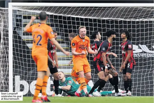  ??  ?? Sean Longstaff celebrates his goal at Bournemout­h