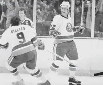  ?? RAY STUBBLEBIN­E/AP FILES ?? Mike Bossy of the New York Islanders reacts after scoring a game-winning goal against the Toronto Maple Leafs in 1978. Bossy is the NHL’s all-time leader in regular season goals per game.