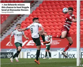  ?? George Wood/PA ?? > Joe Edwards misses this chance to haul Argyle level at Doncaster Rovers